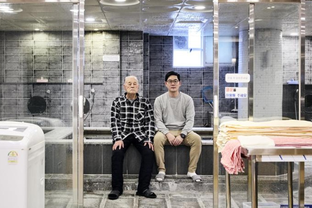 Bongraetang owner Lee Yung-hun (right) and his father sit in their bathhouse in Busan’s Yeongdo district, in South Korea. Photo: Lee Yung-hun