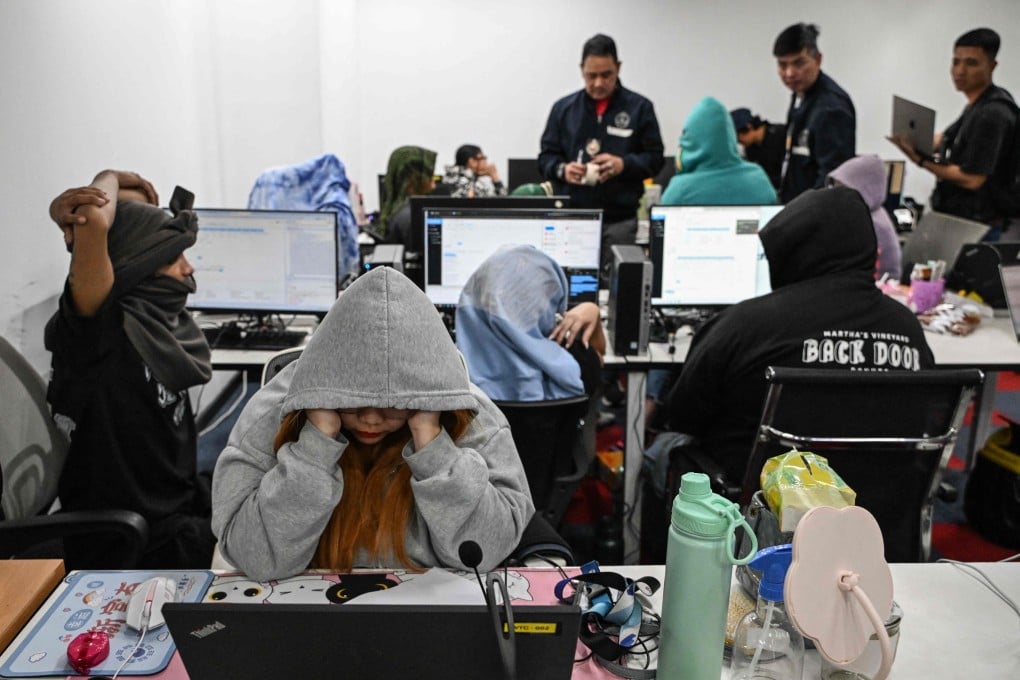 Philippine officials raid an office of a suspected online scam farm in Manila on January 31. Photo: AFP