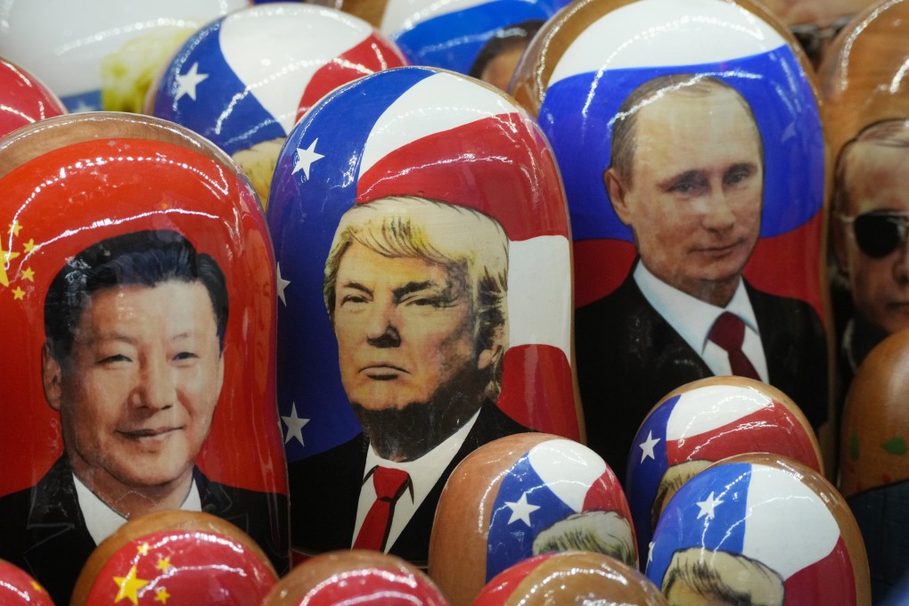 Traditional Russian Matryoshka wooden dolls, depicting (from left) Chinese President Xi Jinping, US President Donald Trump and Russian President Vladimir Putin, are displayed at a souvenir shop in St Petersburg, Russia. Photo: AP