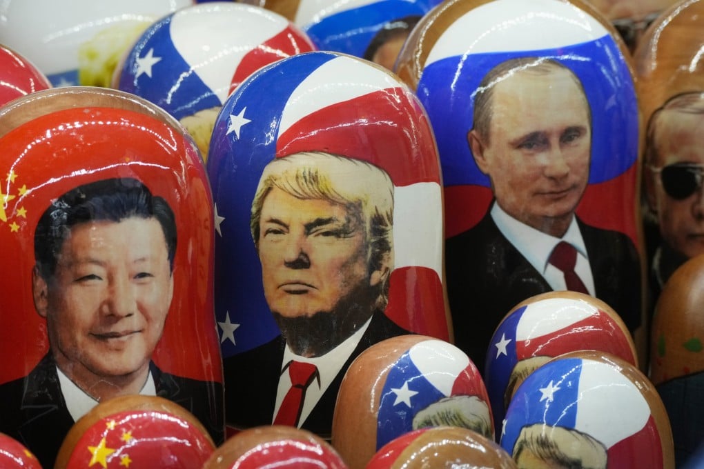 Traditional Russian Matryoshka wooden dolls, depicting (from left) Chinese President Xi Jinping, US President Donald Trump and Russian President Vladimir Putin, are displayed at a souvenir shop in St Petersburg, Russia. Photo: AP