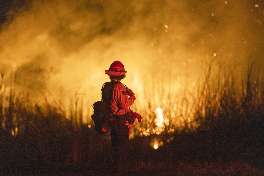 A firefighter monitors the spread of a blaze in Oxnard, northwest of Los Angeles, in January. Photo: TNS