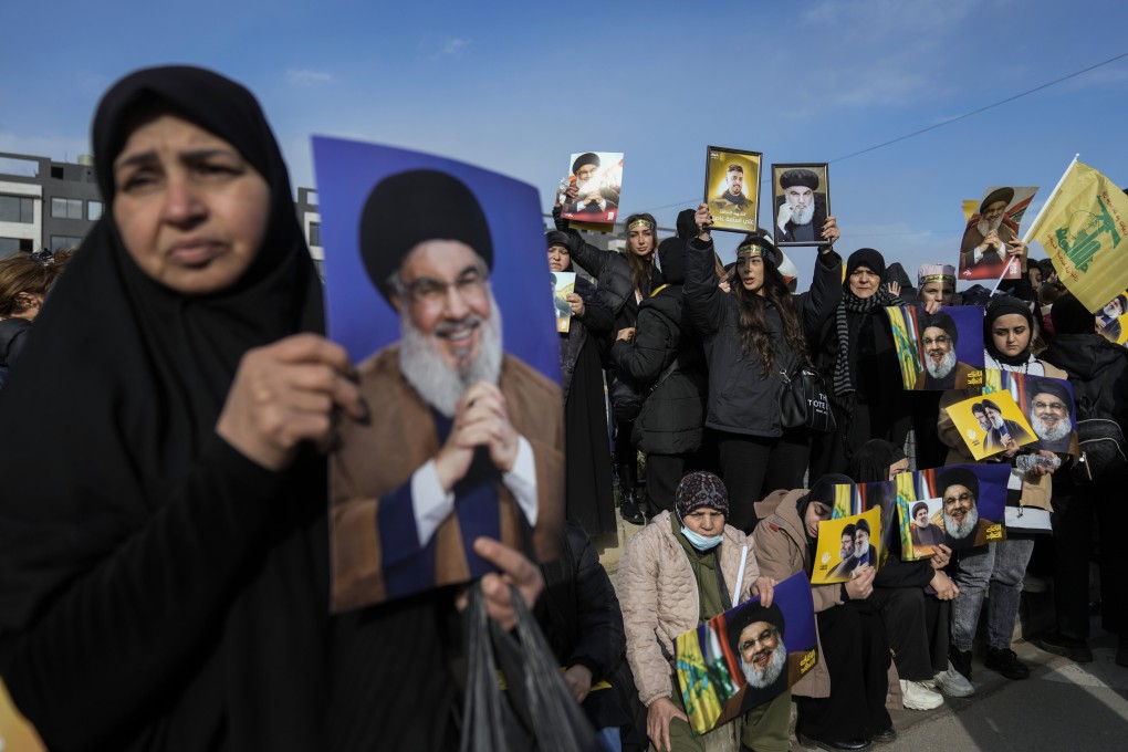 Mourners hold pictures of Lebanon’s former Hezbollah leaders, Hassan Nasrallah and Hashem Safieddine during their funeral procession in Beirut, Lebanon, on Sunday. Photo: AP