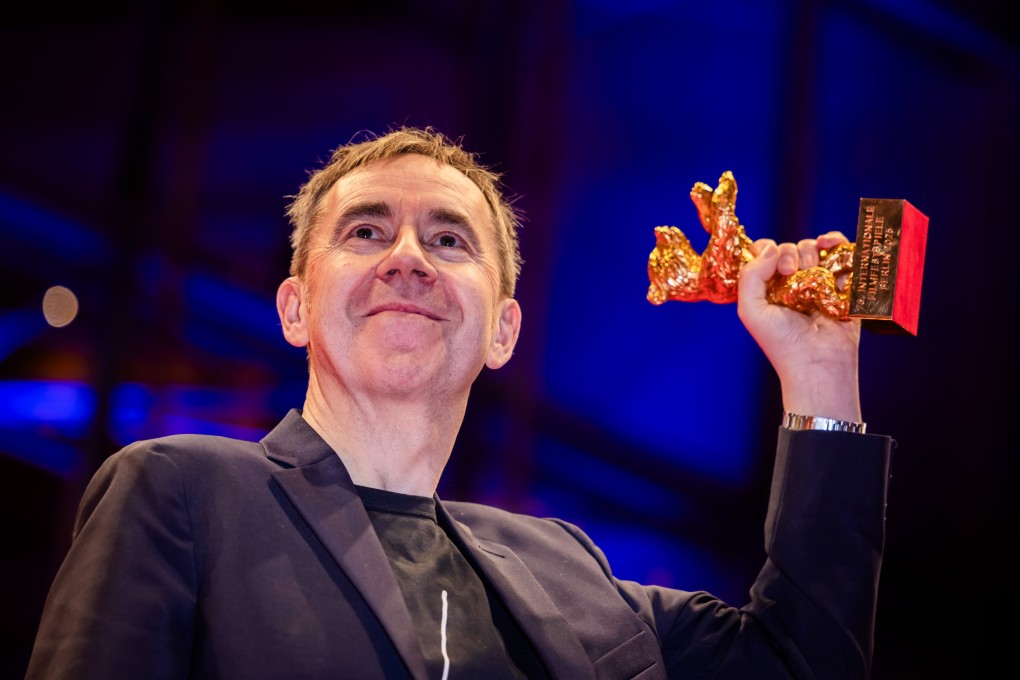 Norwegian director and screenwriter Dag Johan Haugerud  holds his Golden Bear award for best film for Dreams (Sex Love) on the red carpet at the 75th Berlinale International Film Festival. Photo: dpa