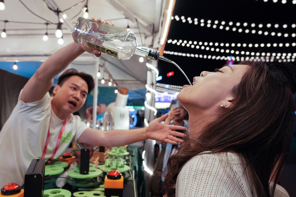 Visitors take part in a drinking competition at the Wine & Dine Festival in Hong Kong in 2024. Discover why one writer has chosen a sober lifestyle, and why a ruler in ancient China decreed the death penalty for people caught drinking. Photo: Eugene Lee