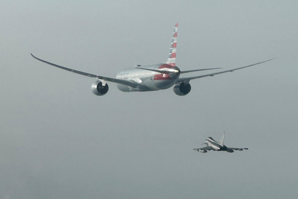 An Italian Air Force Eurofighter aircraft escorts an American Airlines plane. Photo: Italian Air Force via Reuters