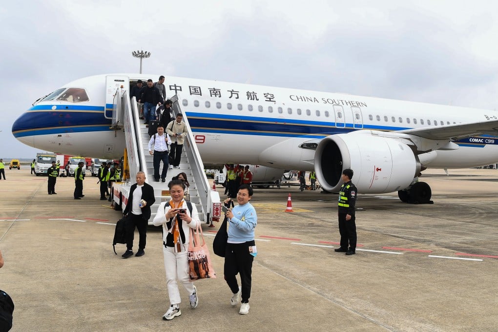 Passengers step off a C919 aircraft operated by China Southern Airlines in Haikou, southern China, in December. The C919 is now being deployed on dozens of domestic routes in China. Photo: Xinhua