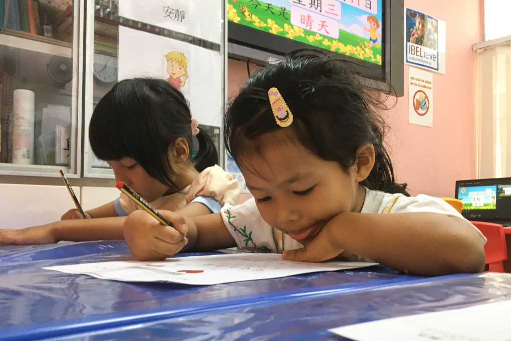 Ethnic-minority children in Hong Hong receive Chinese-language tuition. Dozens of mother tongues are spoken in the city, but the government promotes literacy in Chinese and English. Photo: Cindy Sui