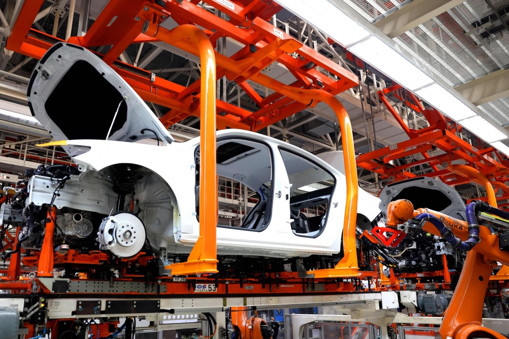 Robots carry out operations in the body shop of the FAW-Volkswagen production based in Qingdao, eastern Shandong province, on February 19. Photo: AFP