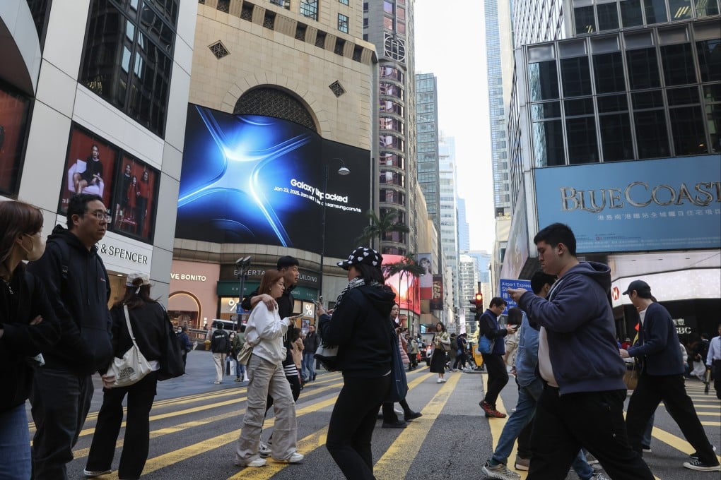 People cross the street in Central. Photo: Edmond So