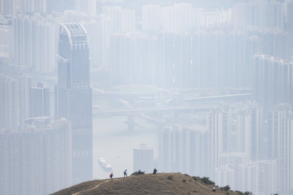 Hikers climb Tai Mo Shan with Tsing Yi and Tsuen Wan in the background on February 25, 2025. Photo: Eugene Lee