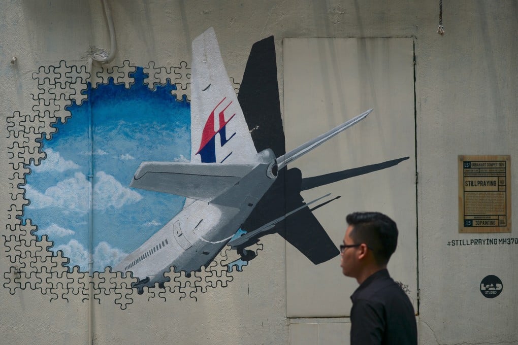 A mural representing the missing Malaysia Airlines flight MH370 at an alley near Kuala Lumpur. Photo: AFP