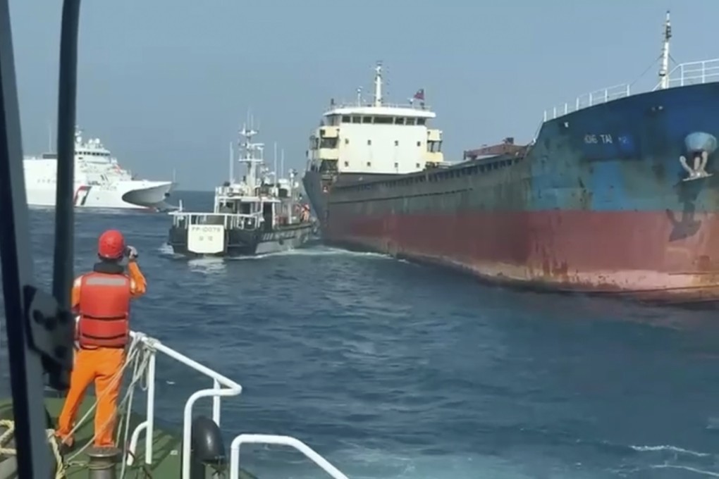 Taiwanese coastguard crews prepare to board the cargo vessel Hong Tai, which is suspected of damaging an undersea communications cable in waters around the outlying Penghu Islands early on Tuesday. Photo: Handout