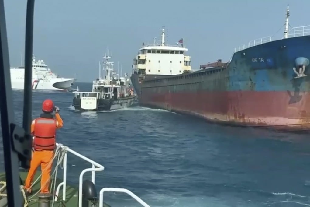 Taiwanese coastguard crews prepare to board the cargo vessel Hong Tai, which is suspected of damaging an undersea communications cable in waters around the outlying Penghu Islands early on Tuesday. Photo: Handout