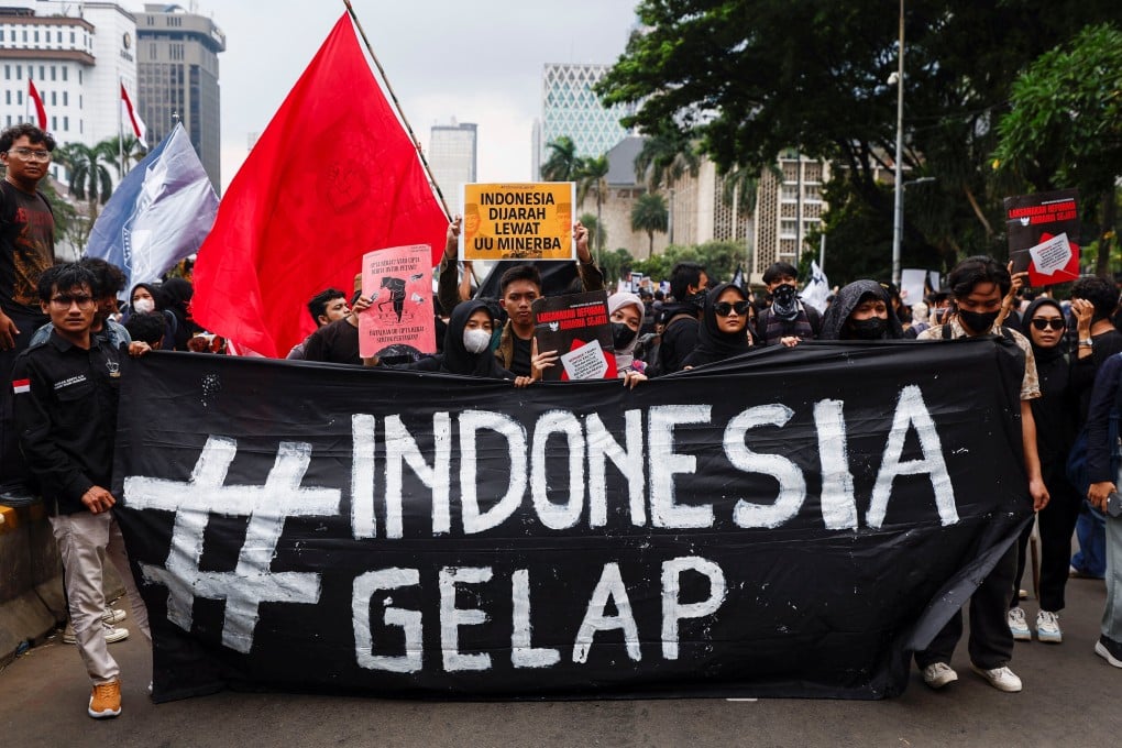 People march during the ‘Indonesia Gelap’ (Dark Indonesia) protest against recent budget cuts and other policies, near the presidential palace in Jakarta, Indonesia, on February 21. Photo: Reuters