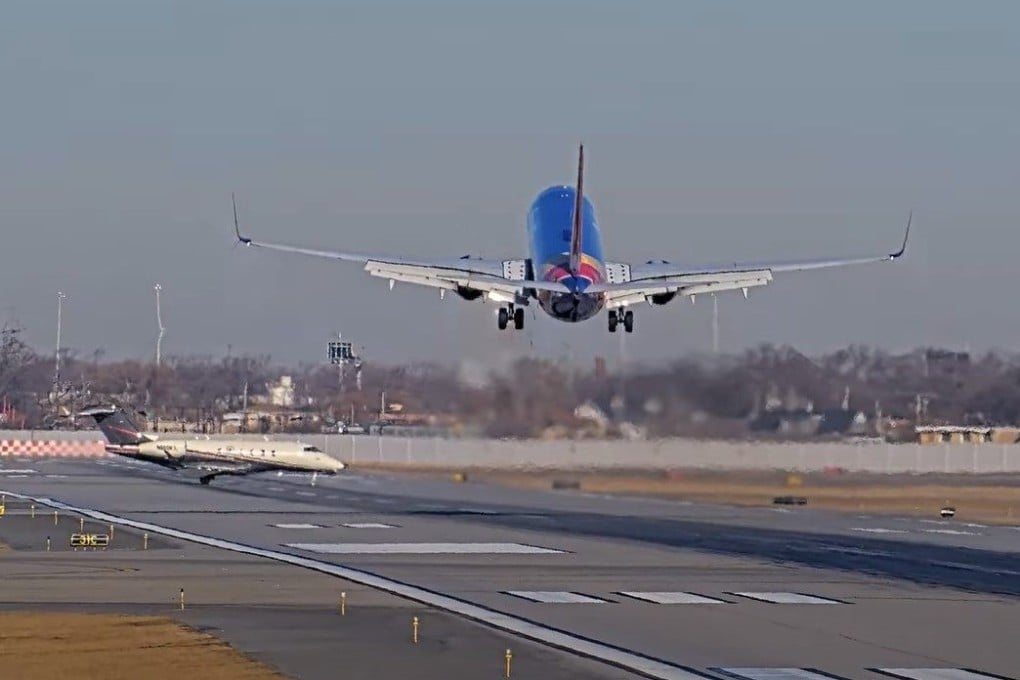 A smaller jet is seen crossing the runway that the passenger plane was set to use. Photo: StreamTime LIVE via YouTube
