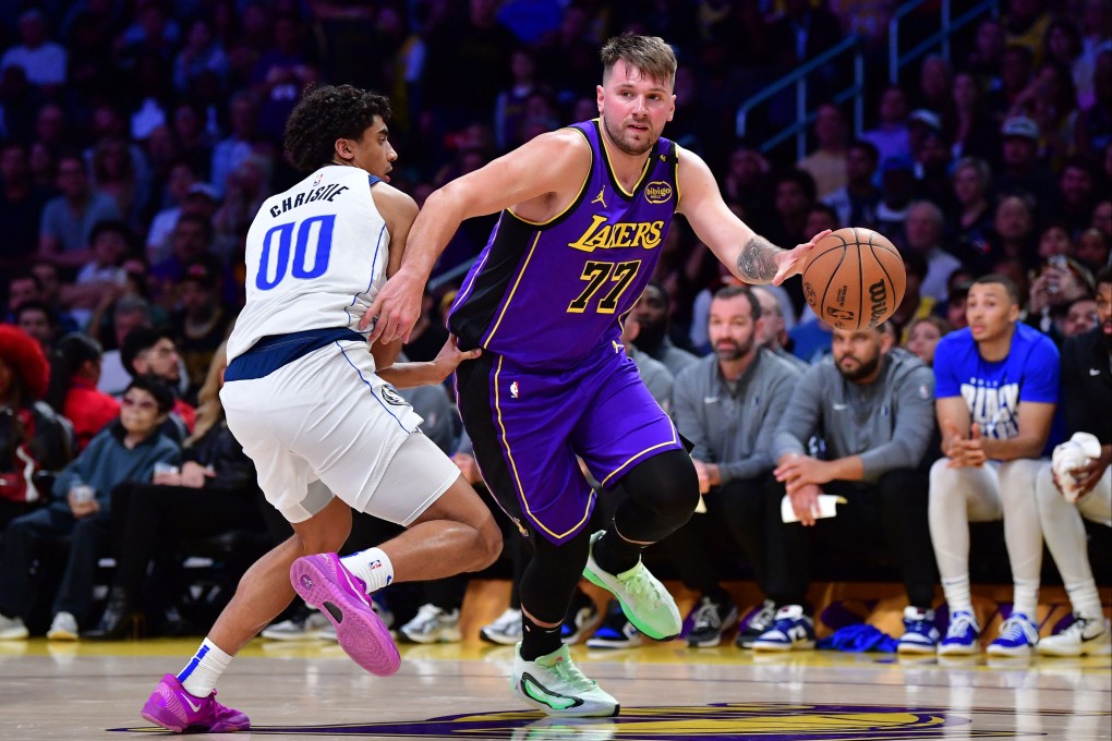 Los Angeles Lakers guard Luka Doncic (right) dribbles past Dallas Mavericks guard Max Christie in the second half at Crypto.com Arena. Photo: Gary A. Vasquez-Imagn Images
