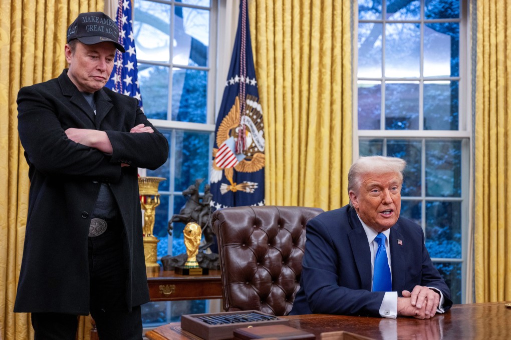 Elon Musk listens as Donald Trump speaks in the Oval Office of the White House in Washington, on February 11. Photo: AFP / Getty Images / TNS