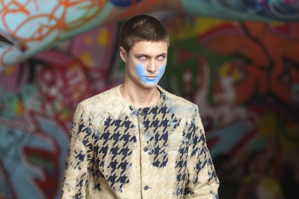 A model with a zombie look and painted-on smile wears a creation from the Diesel autumn/winter 2025-2026 collection presented in Milan, Italy. Photo: AP