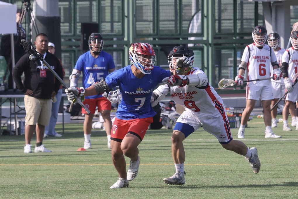 The Philippines’ Jon Dugenio (left) battles with Hong Kong’s Lai Kwok-wang during a World Lacrosse Super Sixes game at Wong Chuk Hang Sports Ground last December. Photo: Jonathan Wong