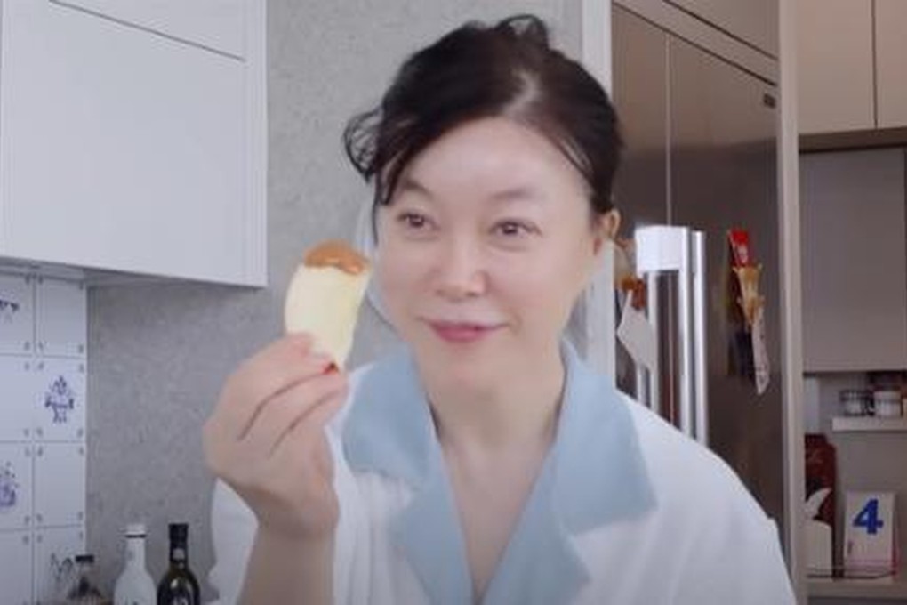 South Korean TV personality Choi Hwa-jung eats apple with peanut butter in a YouTube video in 2024. Korea is going nuts for the spread as part of a “healthy pleasure” trend. Photo: YouTube