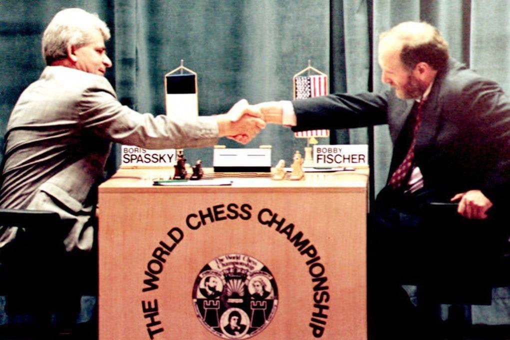Boris Spassky (left) shakes hands with Bobby Fischer at the beginning of their unofficial rematch in Yugoslavia in September 1992. Photo: AFP