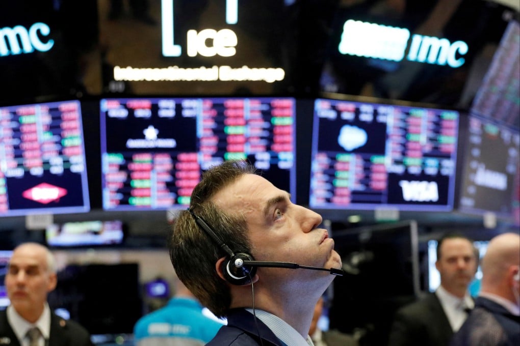 A trader works on the floor of the New York Stock Exchange shortly before the closing bell on February 25, 2020. Photo: Reuters