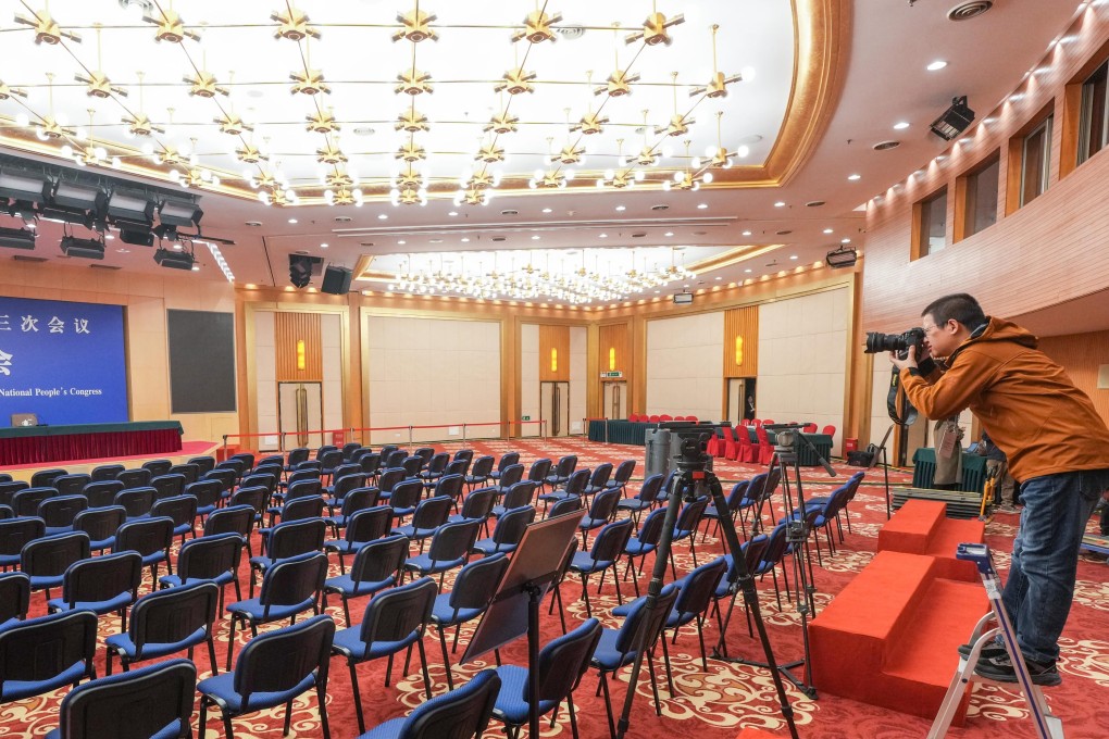 A journalist works in a press centre for China’s annual “two sessions” in Beijing on Thursday. The annual political gatherings will take place next week. Photo: Xinhua