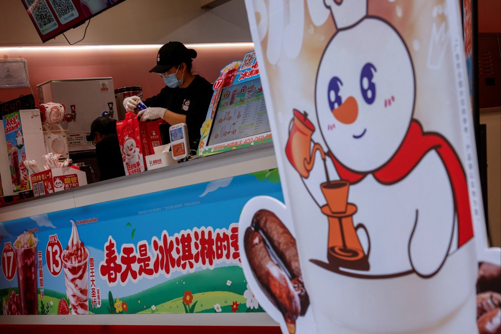 An employee packs a bag at a Mixue store in Mong Kok. Photo: Reuters