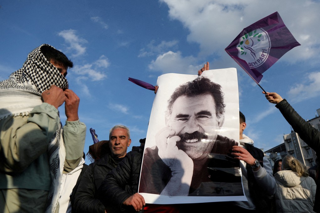 A demonstrator holds a picture of jailed Kurdish militant leader Abdullah Ocalan during a rally in Diyarbakir, Turkey, on Thursday. Photo: Reuters