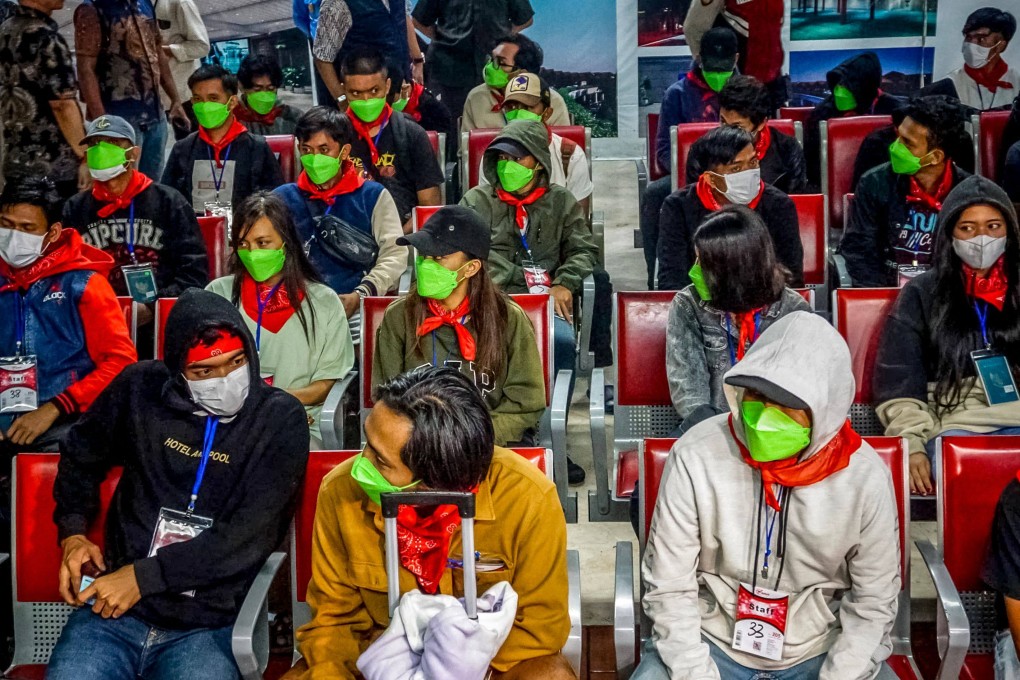 Indonesian nationals, who were victims of human trafficking in Myanmar, arrive at Soekarno Hatta International Airport in Tangerang, Banten province, Indonesia, on Friday. Photo: AFP