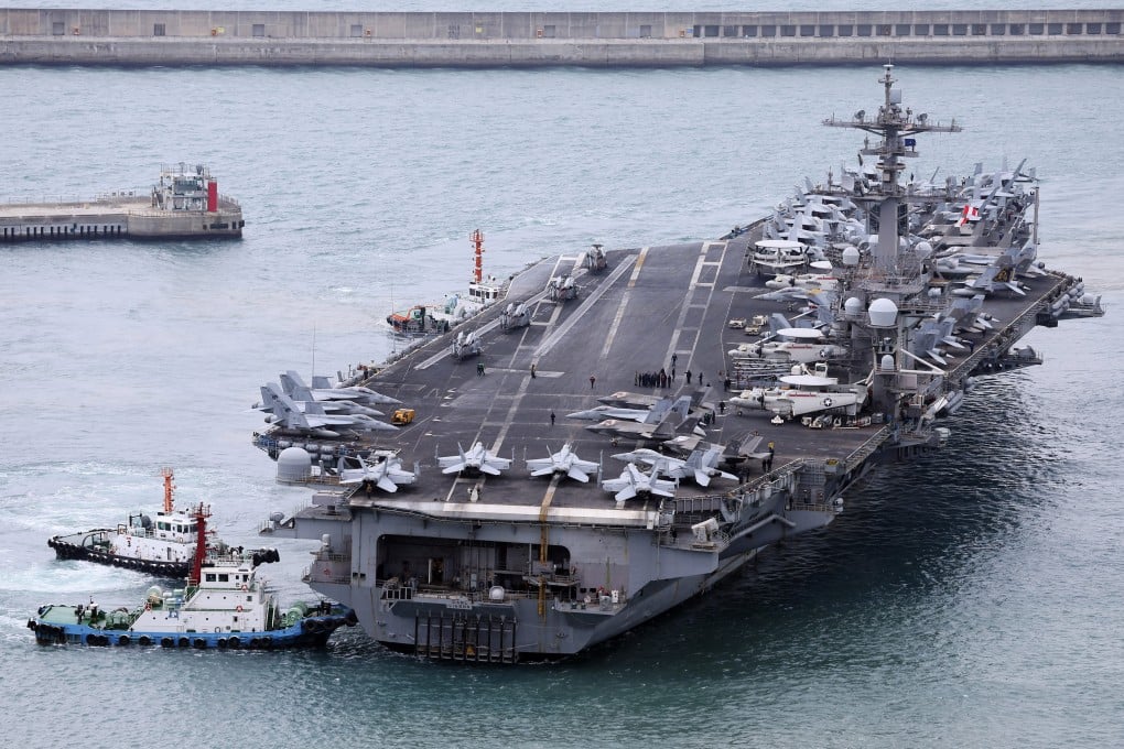 The USS Carl Vinson aircraft carrier is escorted into a navy port in Busan, South Korea, on Sunday. Photo: Ap