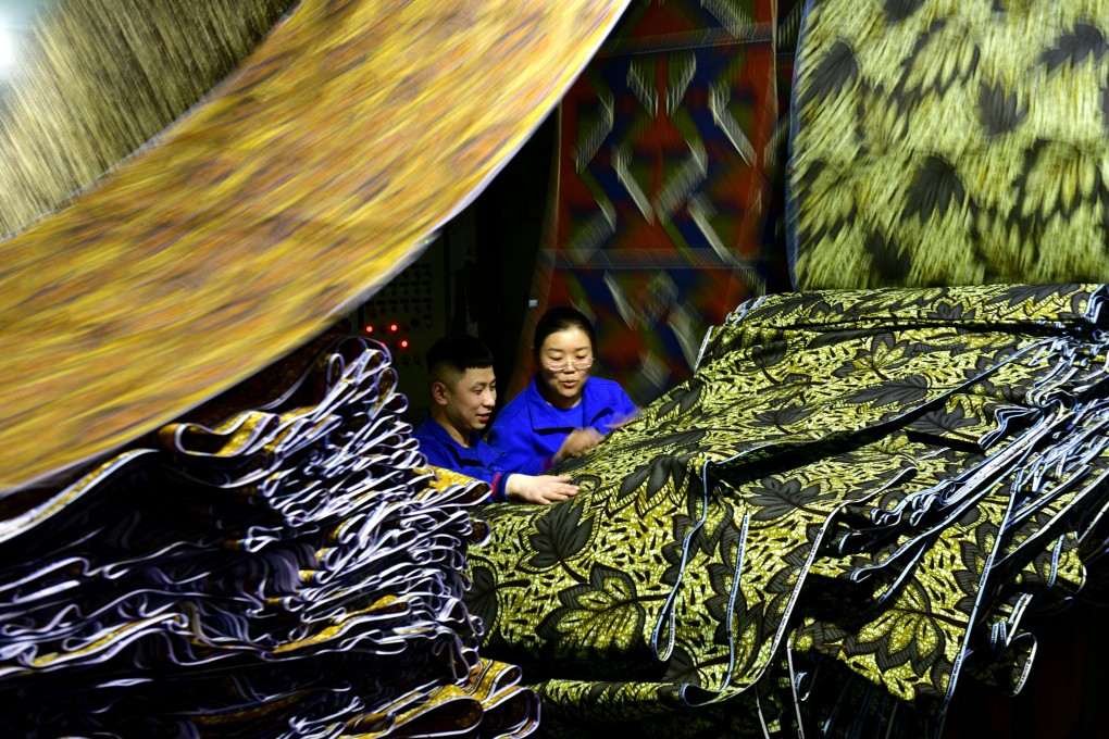 Workers checking fabric for export to Africa at a workshop in Binzhou in east China’s Shandong province on February 25. While trade tensions exist, China is diversifying its trade relationships. Photo: Xinhua
