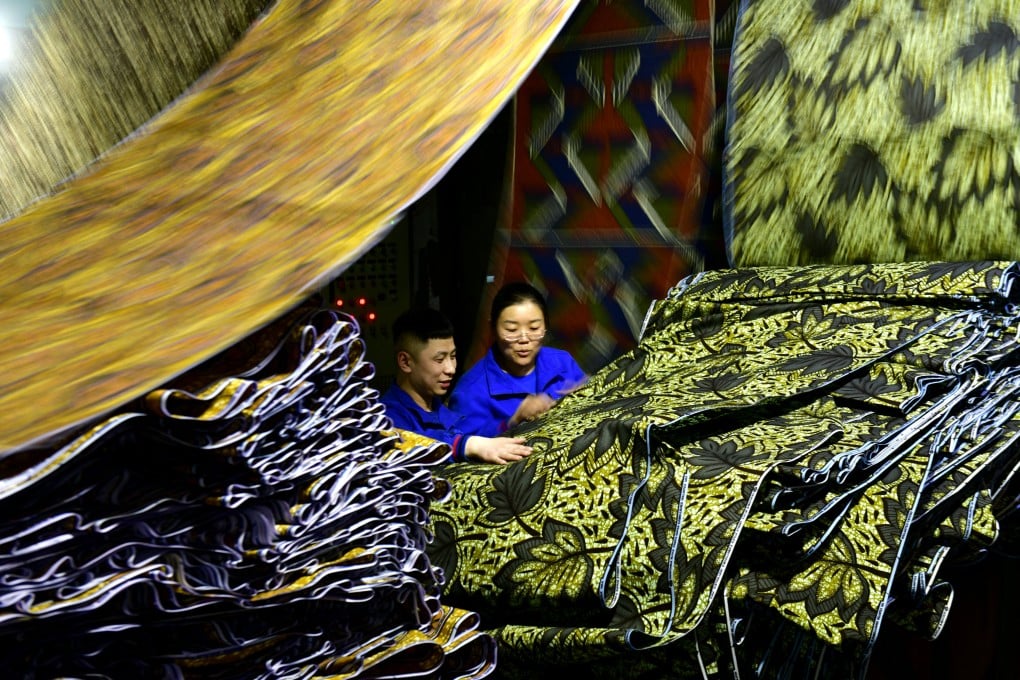 Workers checking fabric for export to Africa at a workshop in Binzhou in east China’s Shandong province on February 25. While trade tensions exist, China is diversifying its trade relationships. Photo: Xinhua