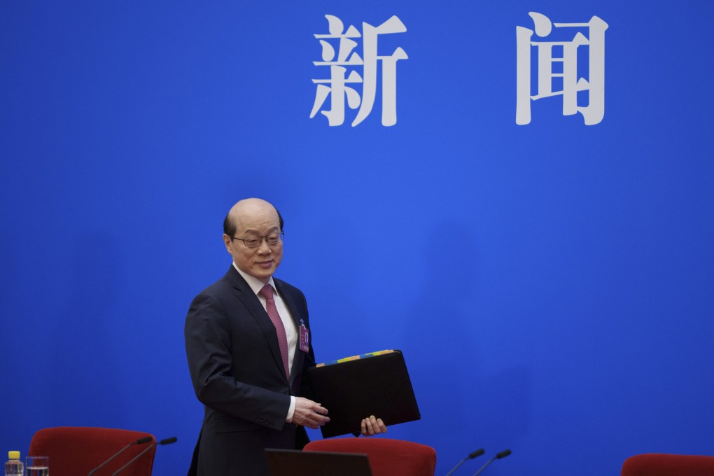 Liu Jieyi, spokesman for China’s top political advisory body, arrives for a press conference ahead of the opening of the Chinese People’s Political Consultative Conference at the Great Hall of the People in Beijing on Monday. Photo: AP