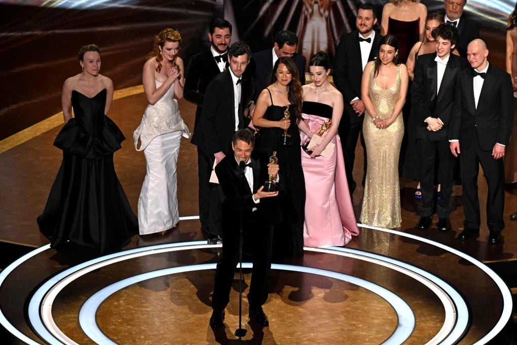 Sean Baker accepts the Oscar for best picture for Anora. Photo: AFP