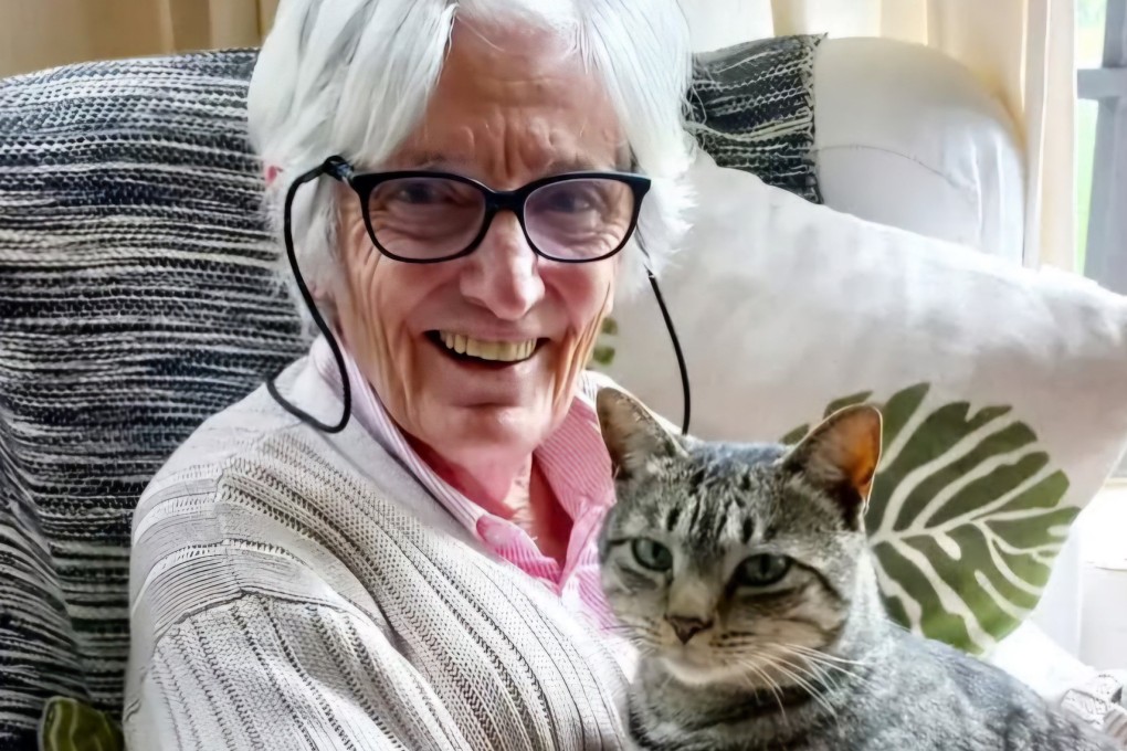 Anthea Rowan’s late mother, Lala Stephen, cuddles the family pet Mr Purr. Research has shown owning or caring for a pet lowers the risk of developing dementia, improves the emotional state of adults who have the condition and may slow their rate of cognitive decline. Photo: Anthea Rowan