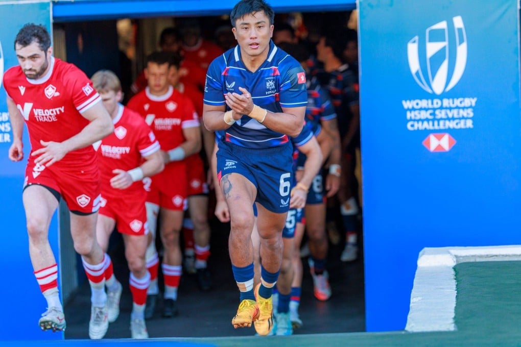 Cado Lee leads the Hong Kong team out in Cape Town against Canada, to whom they lost 21-12. Photo: World Rugby