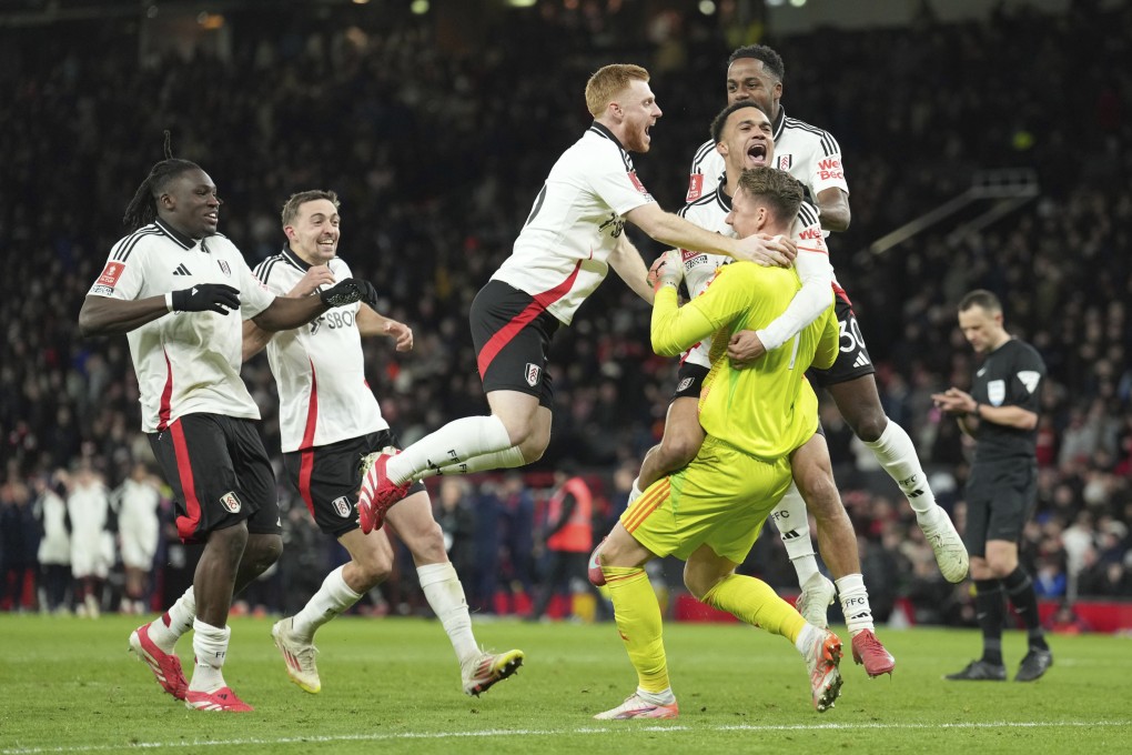 Fulham players celebrate after beating Manchester United in a penalty shootout at Old Trafford. Photo: AP