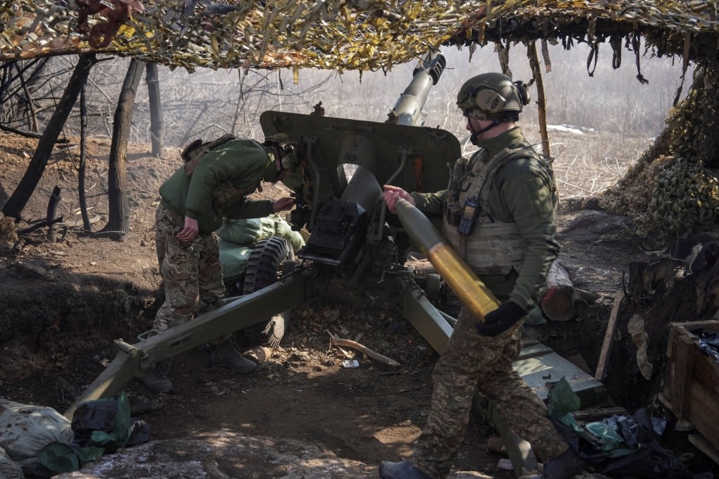 Ukrainian servicemen fire a howitzer towards Russian troops near the town of Pokrovsk, Donetsk region, on March 3. Photo: Reuters