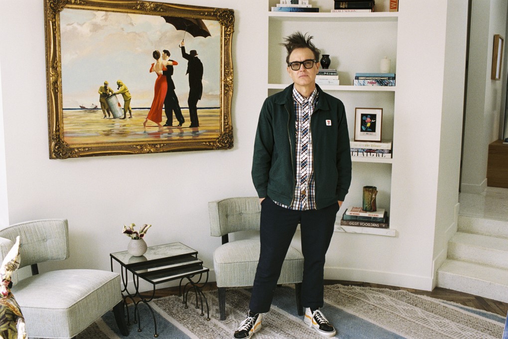 Mark Hoppus of Blink-182 poses stands by his painting Crude Oil (Vettriano) by Banksy (2005), which is being auctioned by Sotheby’s on Monday. Photo: Sotheby’s via AP