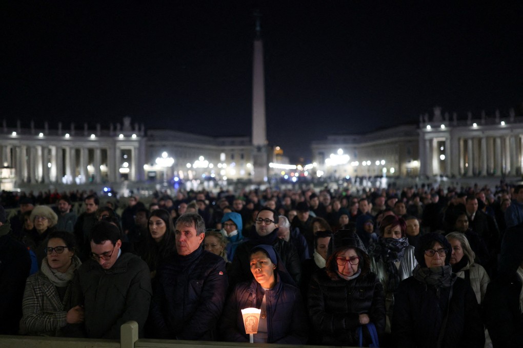Faithful attend a prayer service in St Peter’s Square, as Pope Francis continues his hospitalization, at the Vatican. Photo: Reuters