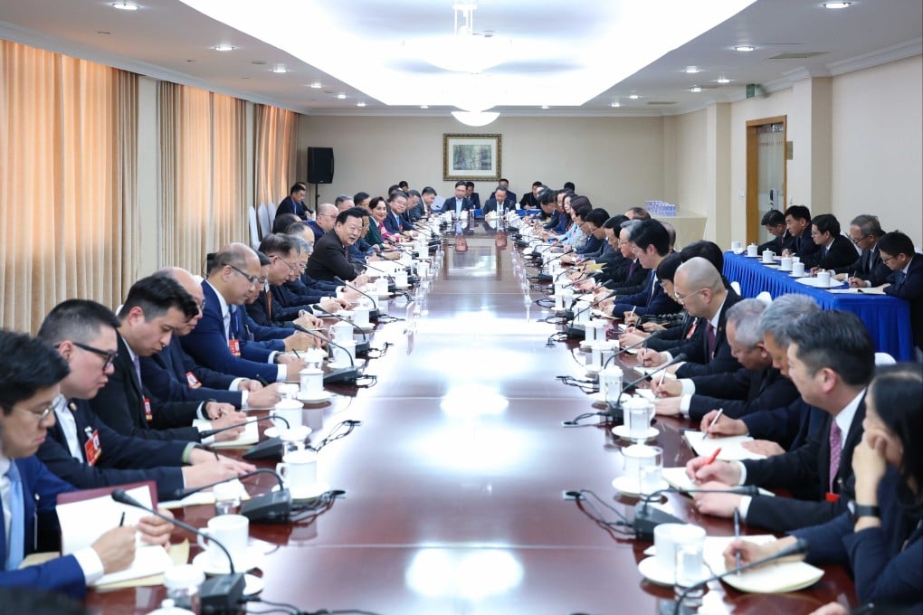 Xia Baolong holds a closed-door meeting with NPC deputies from Hong Kong and Macau on Tuesday night. Photo: Handout