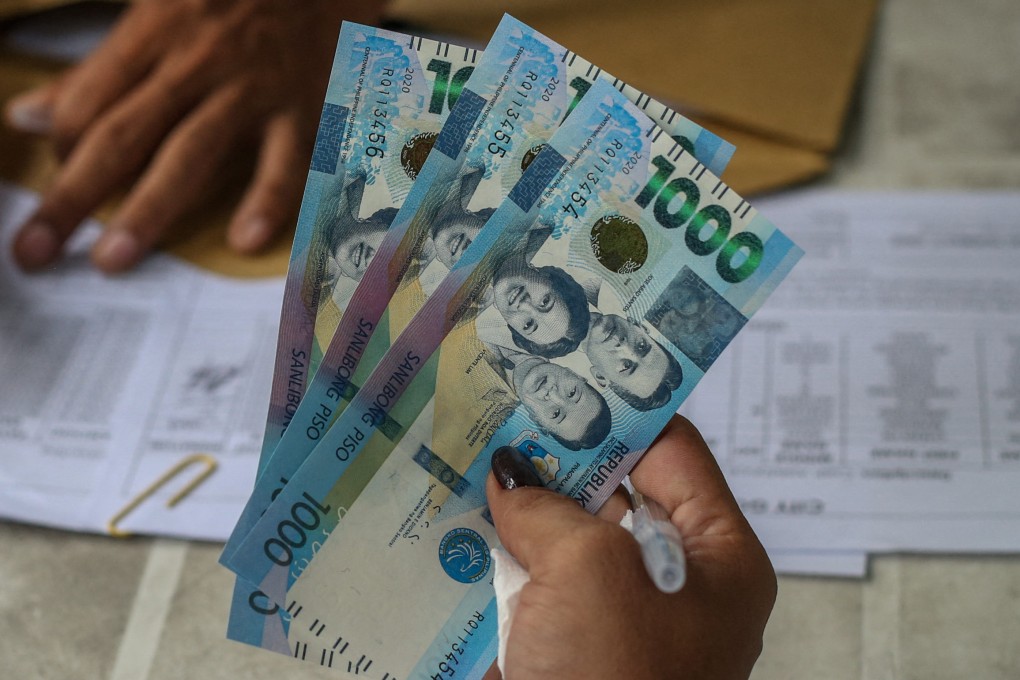 Philippine 1,000-peso banknotes. The groups under investigation reportedly donated 500,000 pesos to the mayor of Tarlac city, plus motorbikes and patrol vehicles to local police. Photo: AFP