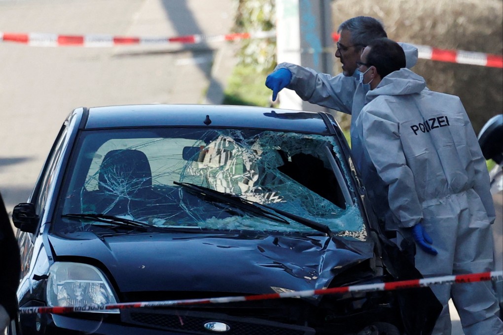 Police examine the vehicle used in the attack. Photo: Reuters