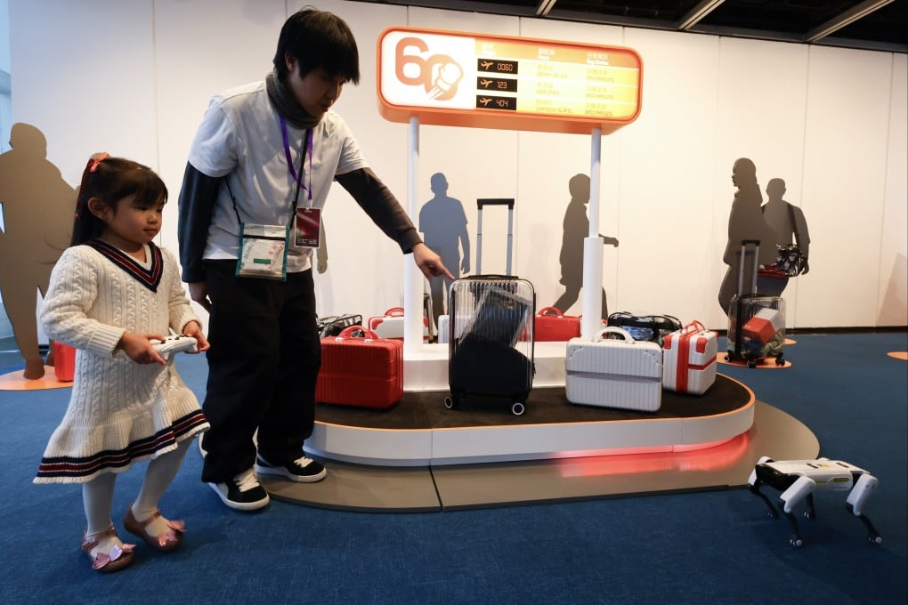 A child operates a remote robot at an event organised by the Action Committee Against Narcotics and the Narcotics Division of the Security Bureau at Hong Kong City Hall on February 7. Photo: SCMP