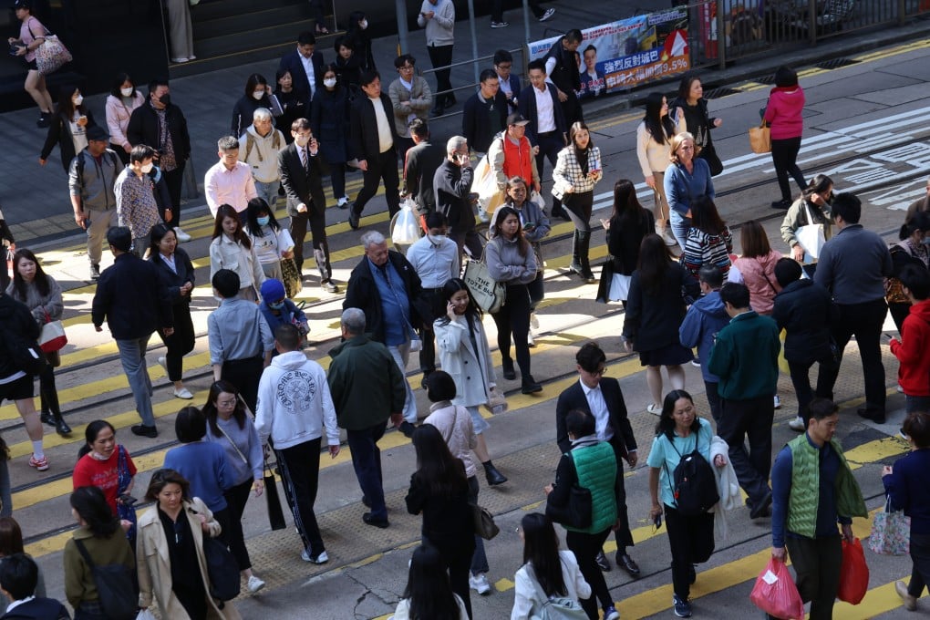 People cross a road in Central during lunch hour on January 6, 2025. Photo: Jelly Tse