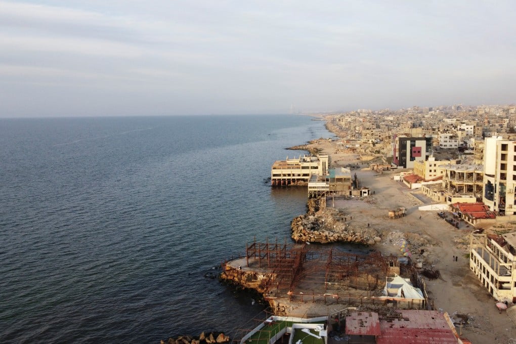 Palestinians spending time on a beach, amid a ceasefire between Israel and Hamas, in Gaza City. Photo: Reuters