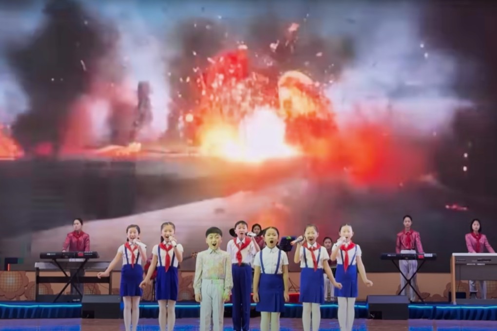 Visitors on an organised tour to Rason in North Korea got to watch children sing against a backdrop of an explosion. Photo: YouTube/Mike Okay