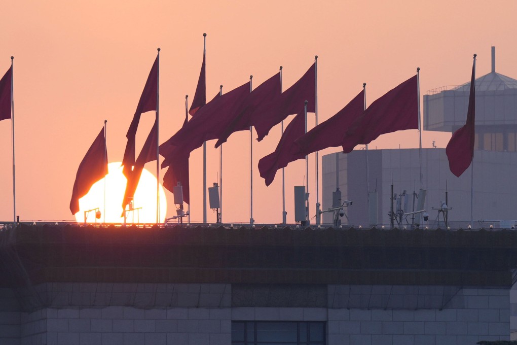 The sun rises near the Great Hall of the People in Beijing on Wednesday. Beijing and Washington this week signaled vastly different priorities over their spending on science. Photo: Kyodo
