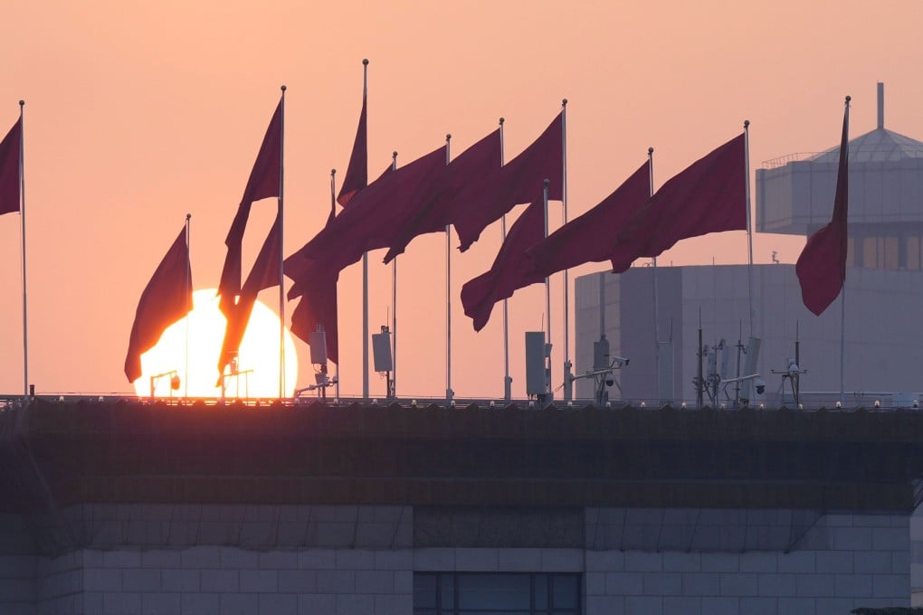 The sun rises near the Great Hall of the People in Beijing on Wednesday. Beijing and Washington this week signaled vastly different priorities over their spending on science. Photo: Kyodo